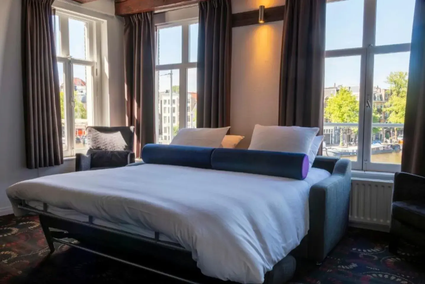Apartment living area with view of the Amstel